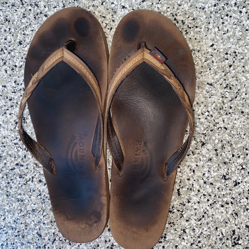 Used women rainbow flip flops.